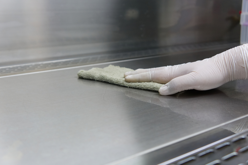 scientist was cleaning laminar flow hood