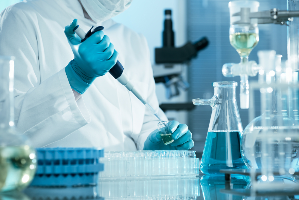 scientist working with glassware in the laboratory